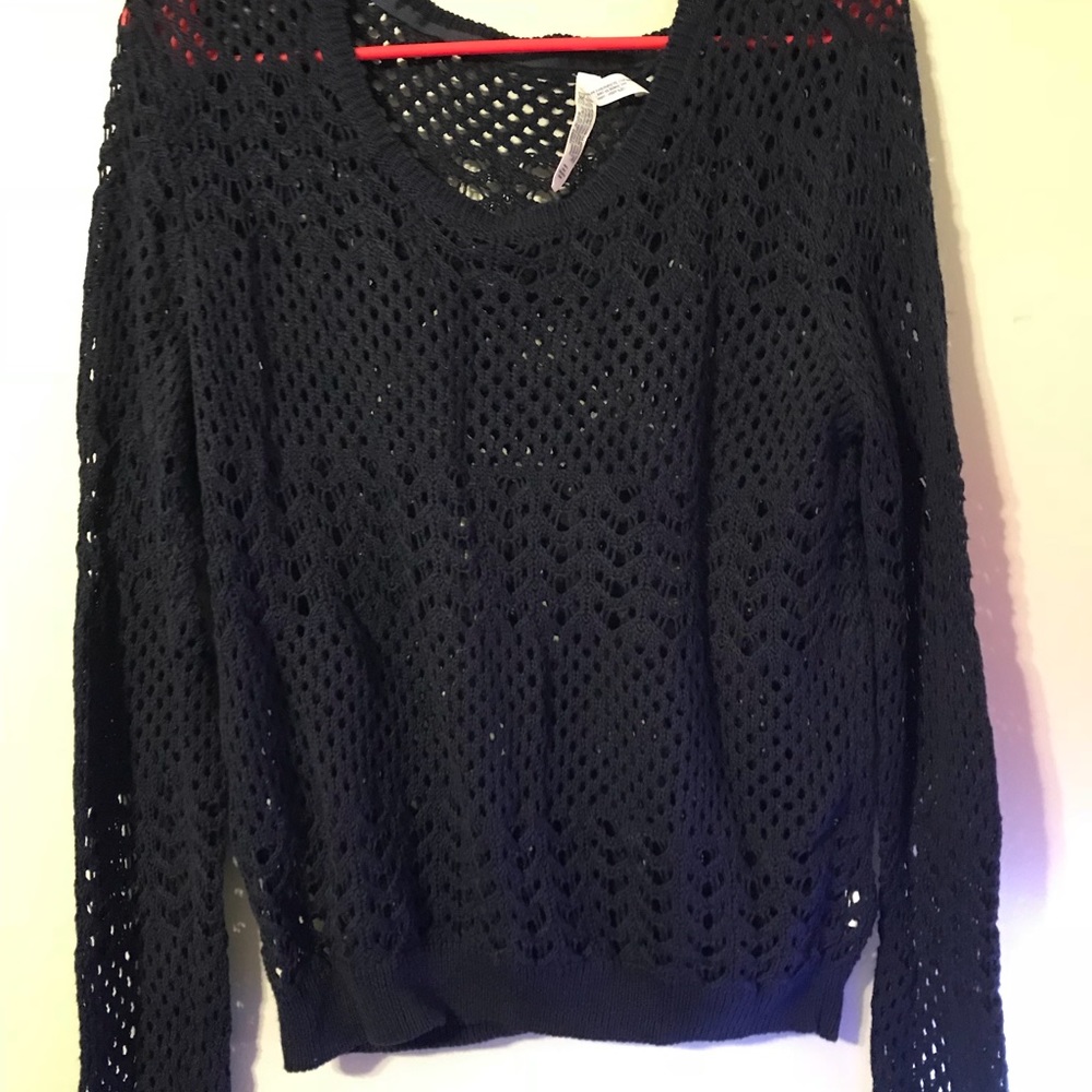 Knit pullover over sweater